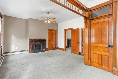 a view of an empty room with closet area