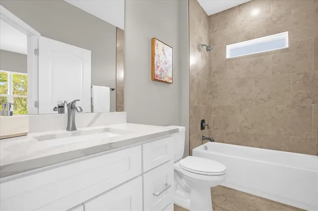 a bathroom with a sink a toilet and a bathtub