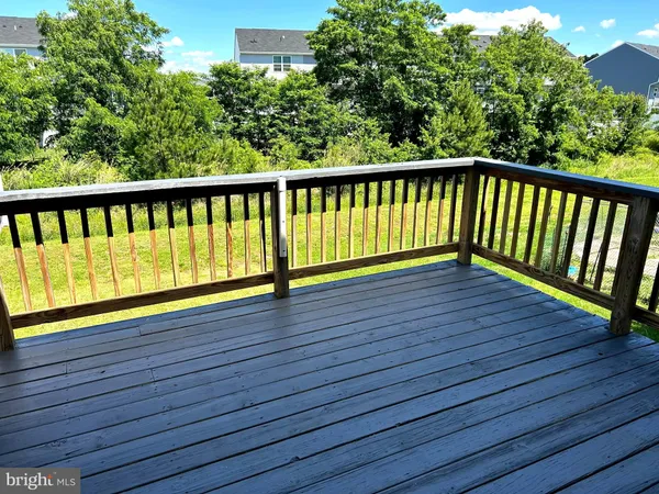 a view of balcony with wooden floor