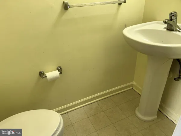 a bathroom with a sink and toilet