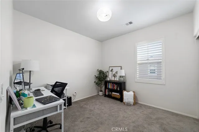 a room with furniture and a window