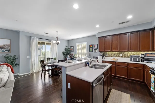 a kitchen with lots of counter top space and dining table