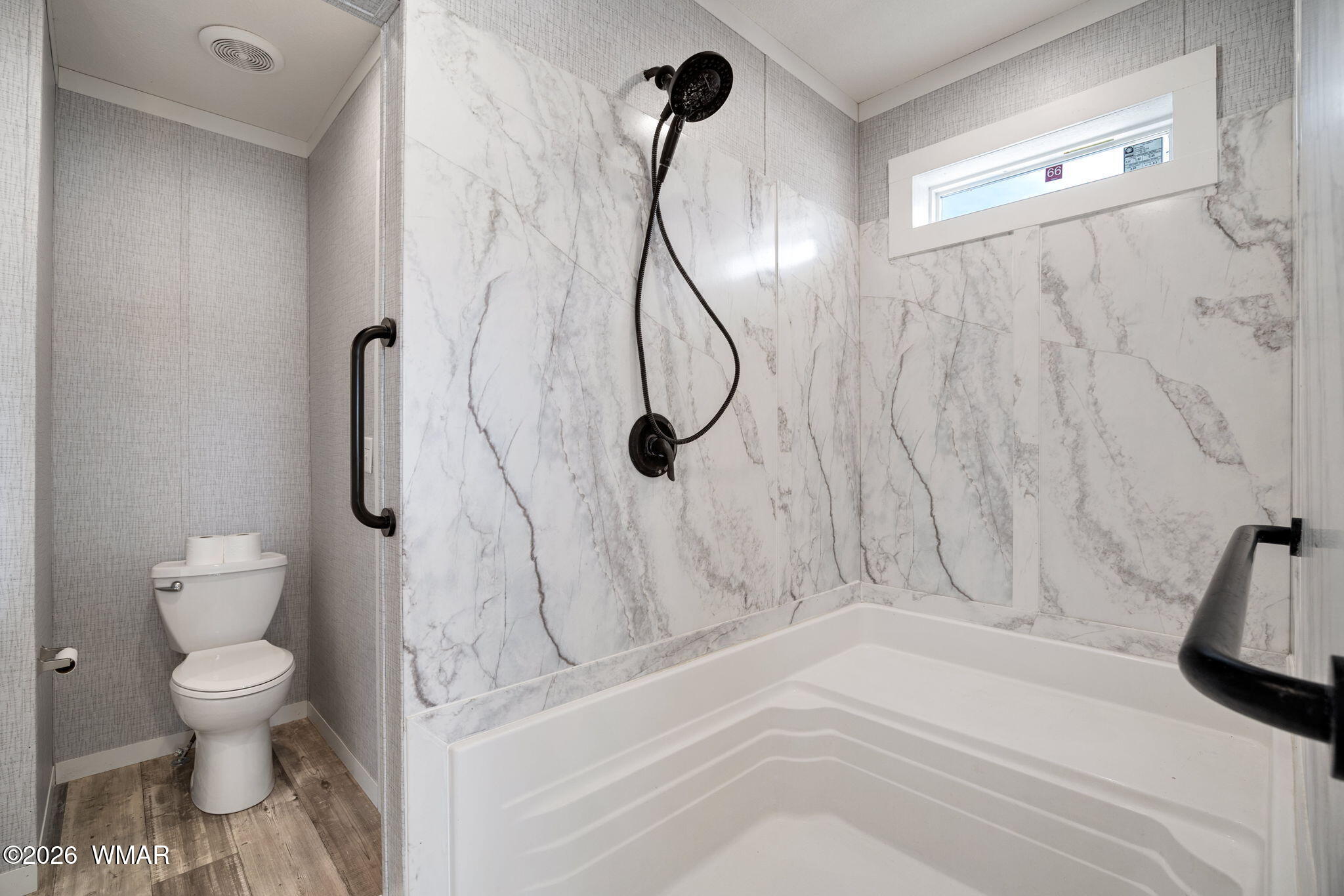 159 County Road St. Johns, AZ 85936 - Photo 23 of 59 a bathroom with a white toilet and a shower