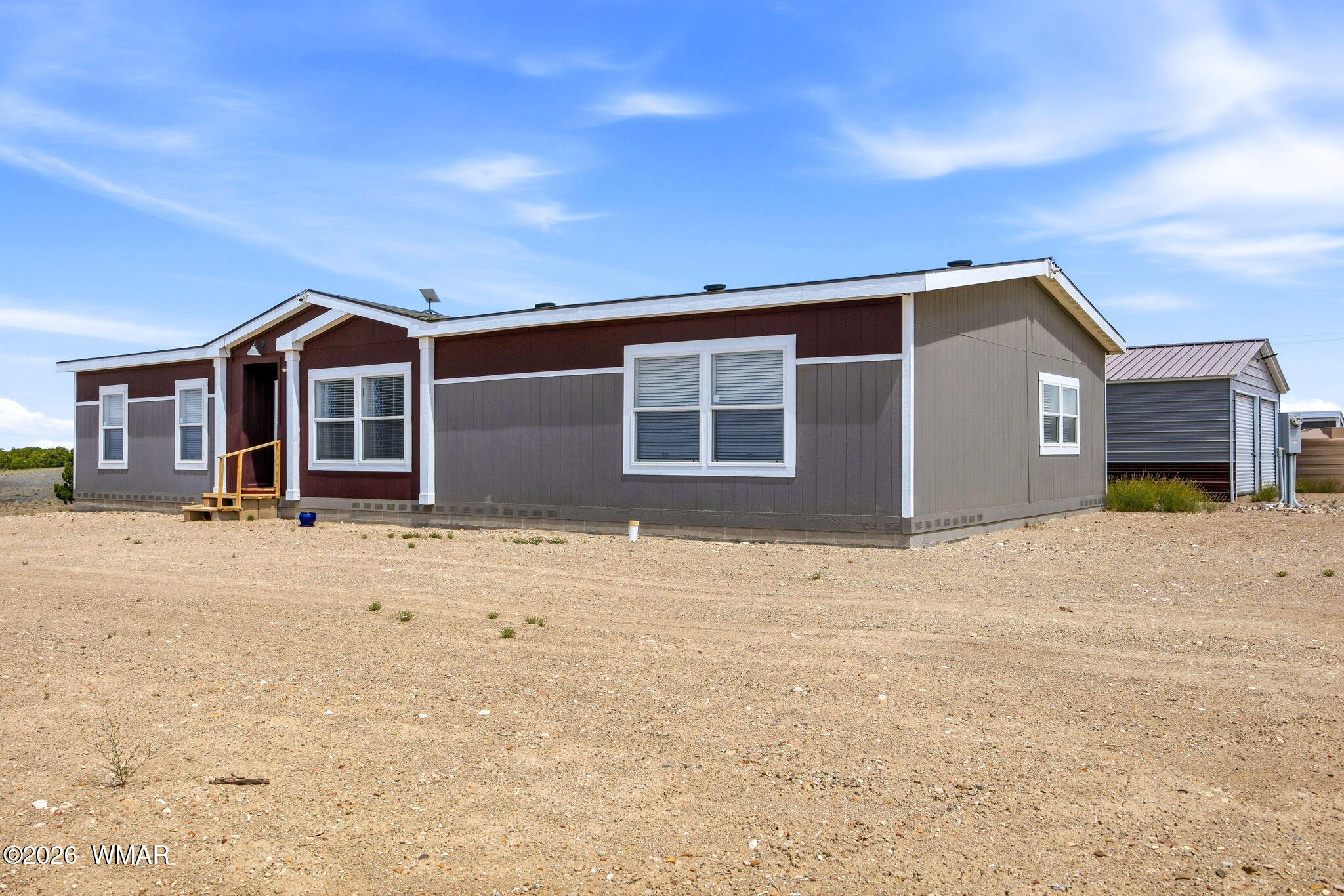 159 County Road St. Johns, AZ 85936 - Photo 59 of 59 a front view of a house with a yard and garage