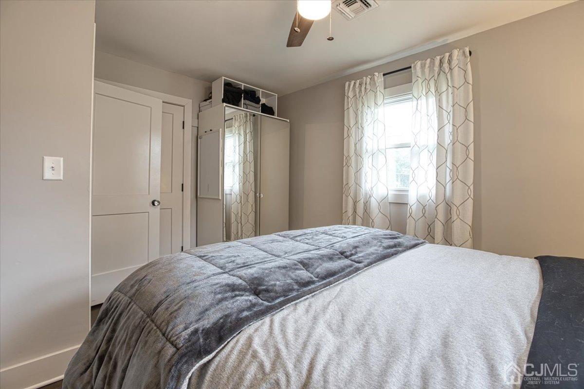 29 Clark Drive Howell, NJ 07731 - Photo 23 of 38 a bedroom with a bed and a window