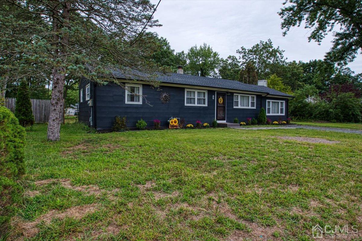 29 Clark Drive Howell, NJ 07731 - Photo 30 of 38 a view of a house with a big yard and large trees