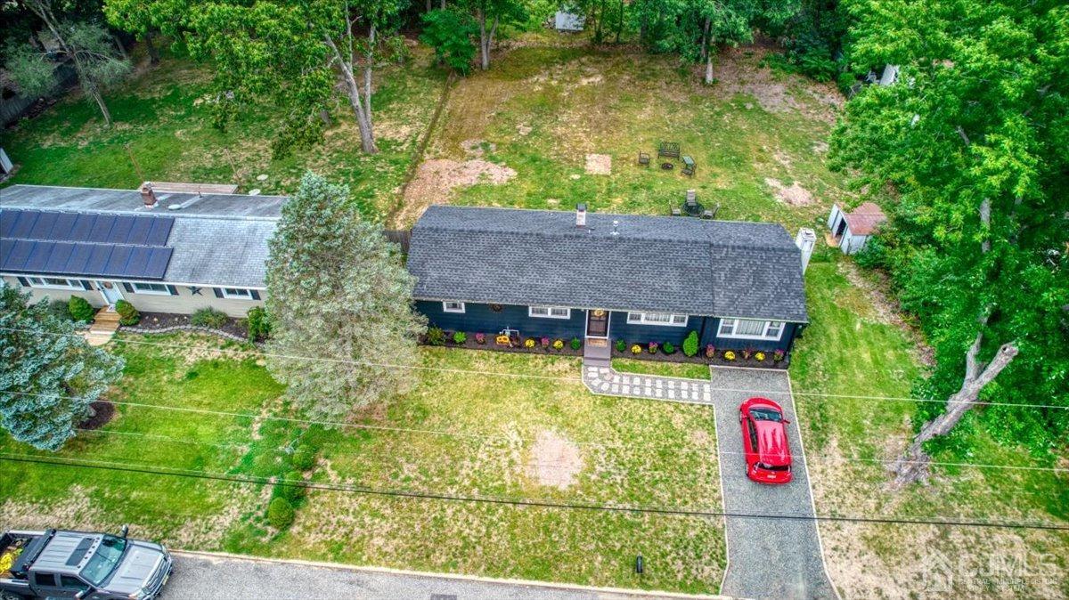 29 Clark Drive Howell, NJ 07731 - Photo 33 of 38 an aerial view of residential house with outdoor space and trees around