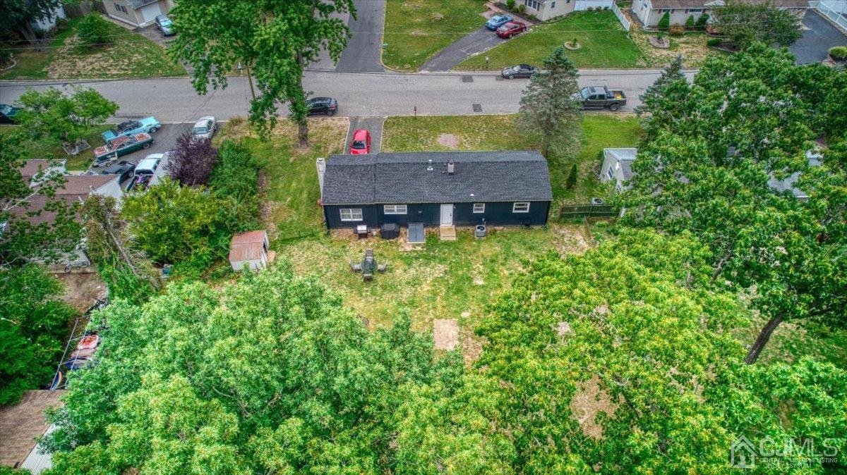 29 Clark Drive Howell, NJ 07731 - Photo 35 of 38 an aerial view of a house with swimming pool and garden
