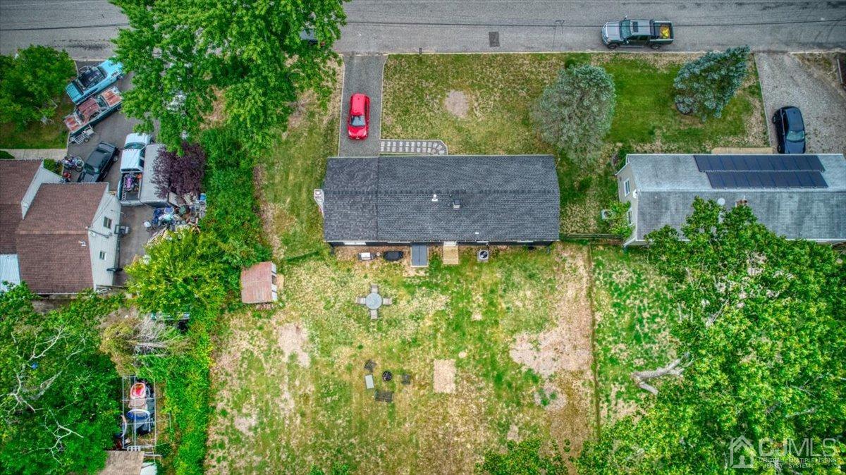 29 Clark Drive Howell, NJ 07731 - Photo 36 of 38 a aerial view of a house with a yard and garden