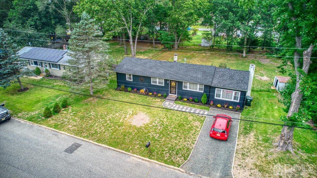 29 Clark Drive Howell, NJ 07731 - Photo 37 of 38 a view of a wooden dinning table and chairs in the garden