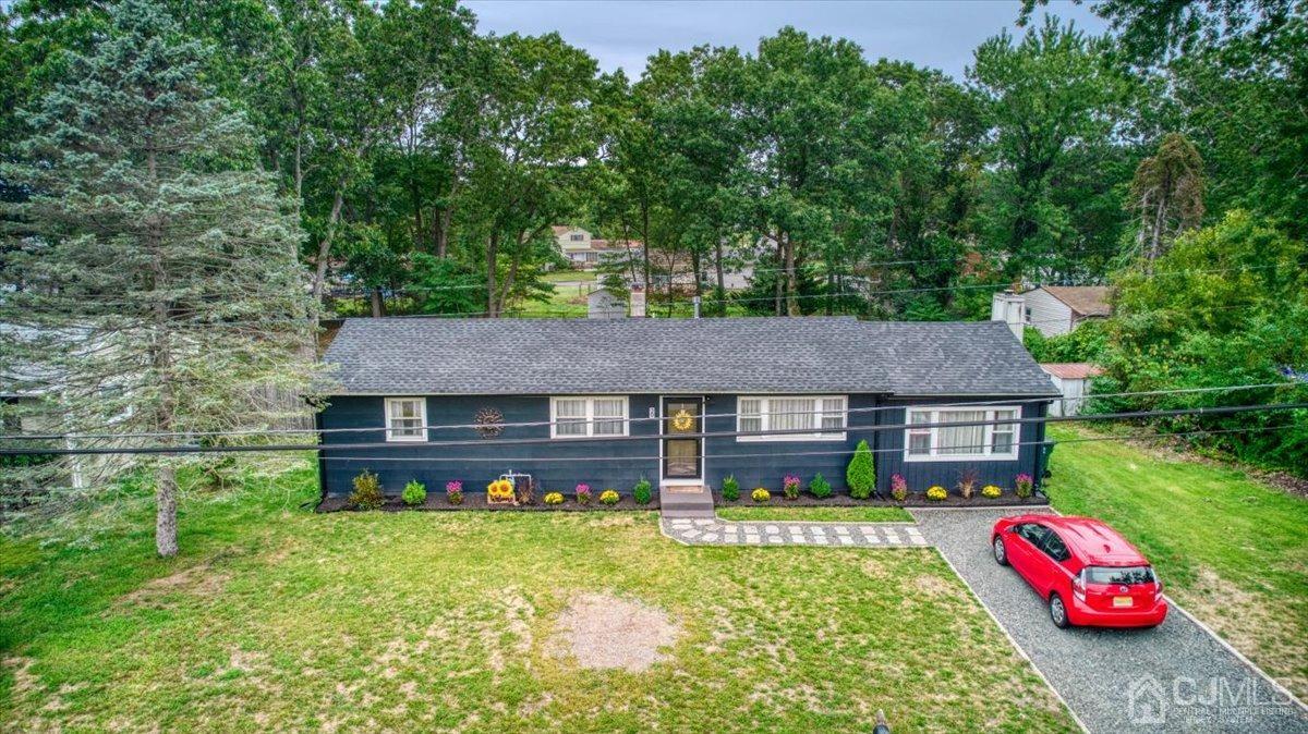 29 Clark Drive Howell, NJ 07731 - Photo 38 of 38 a front view of a house with garden