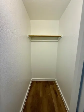 a view of small space with empty racks on the wall
