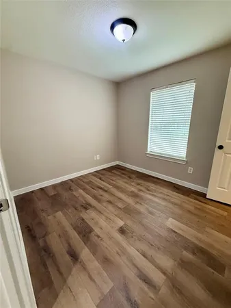 an empty room with a empty space and a window