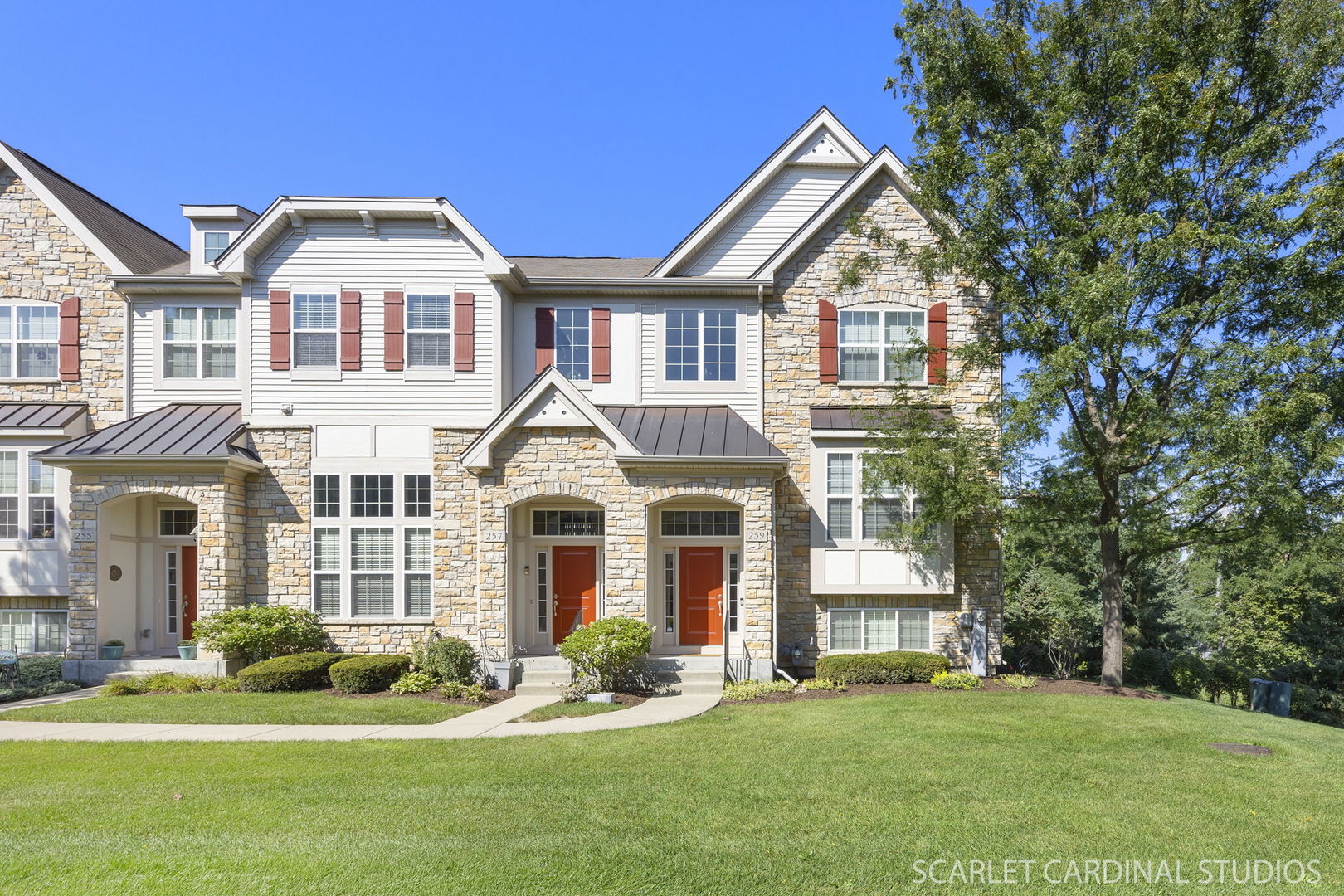 a front view of a house with a yard