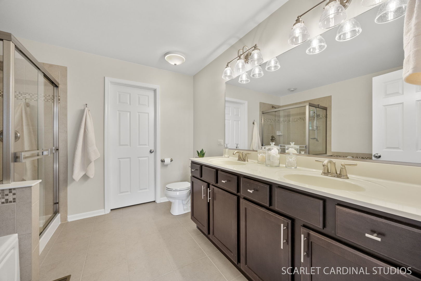 259 Bennett Drive Carol Stream, IL 60188 - Photo 23 of 31 a bathroom with a double vanity sink mirror and shower
