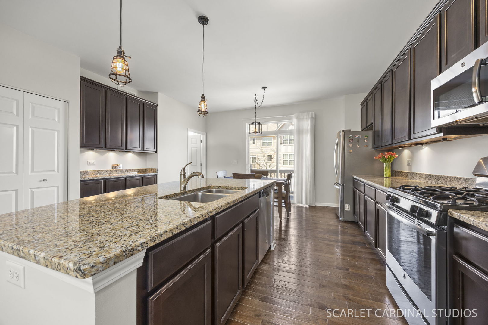259 Bennett Drive Carol Stream, IL 60188 - Photo 5 of 31 a kitchen with stainless steel appliances granite countertop a sink stove and refrigerator