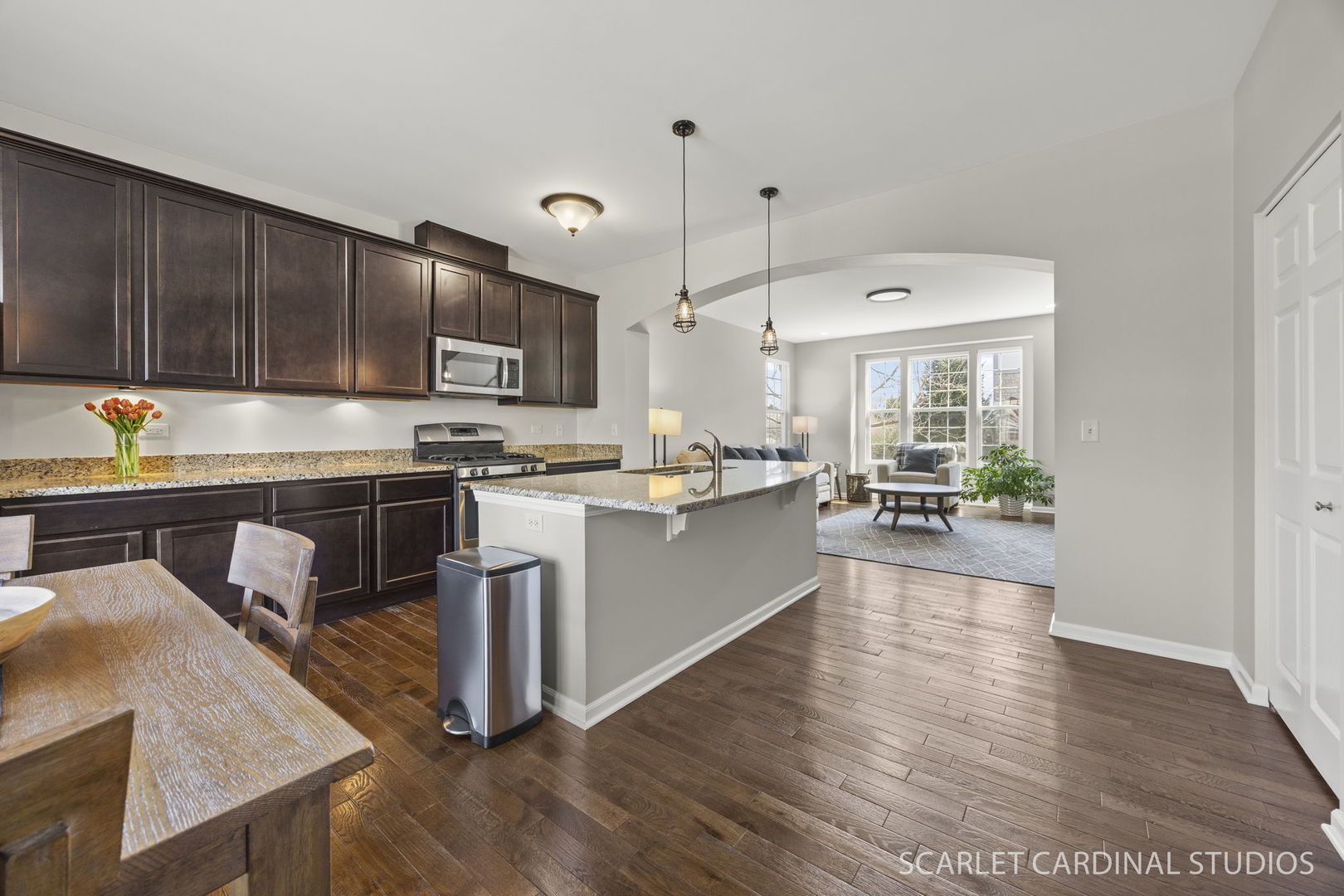 259 Bennett Drive Carol Stream, IL 60188 - Photo 6 of 31 a kitchen with stainless steel appliances granite countertop a stove a sink dishwasher and a refrigerator with wooden floor