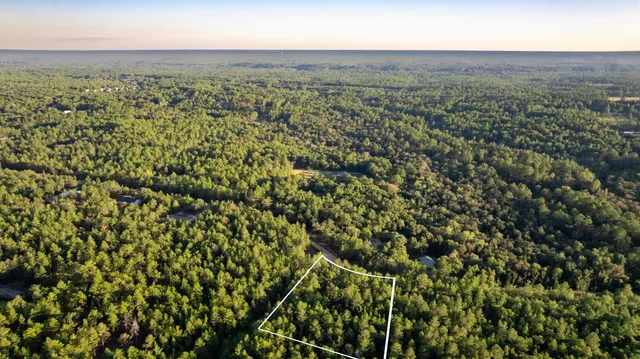 an aerial view of houses with yard