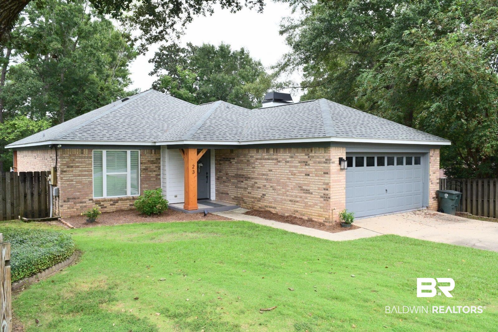 23 Parma Drive Daphne, AL 36526 - Photo 1 of 1 Ranch-style house with a front lawn and a garage