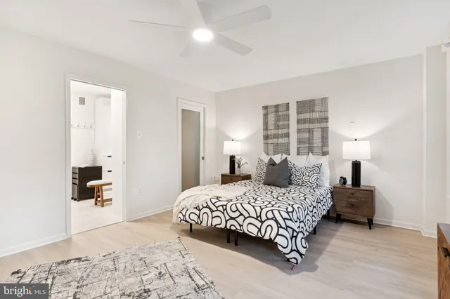 a view of a hallway with wooden floor and windows