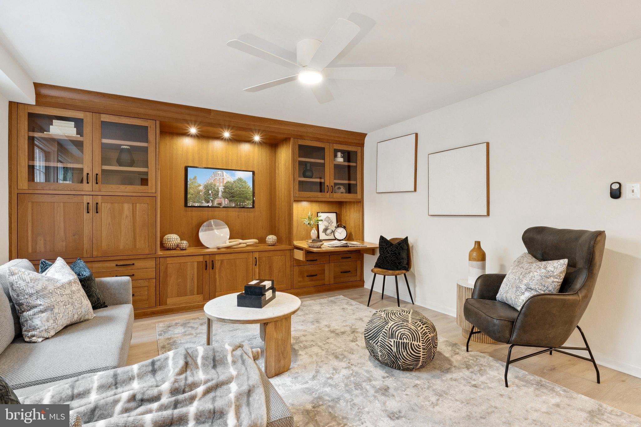 1880 Columbia Road Northwest, Unit 204 Washington, DC 20009 - Photo 2 of 23 a living room with furniture and a large window
