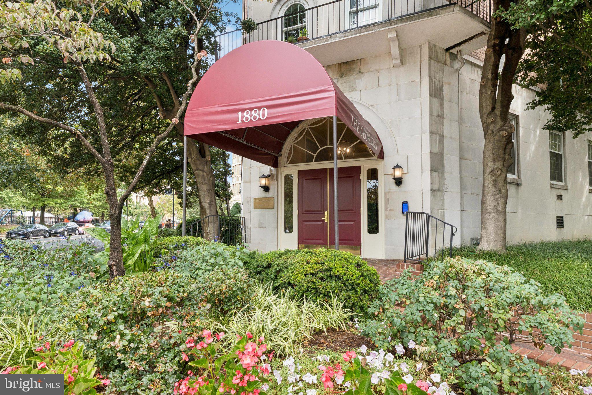 1880 Columbia Road Northwest, Unit 204 Washington, DC 20009 - Photo 22 of 23 a view of a house with a small yard and plants