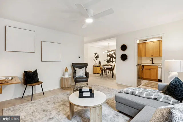 a living room with furniture and white walls