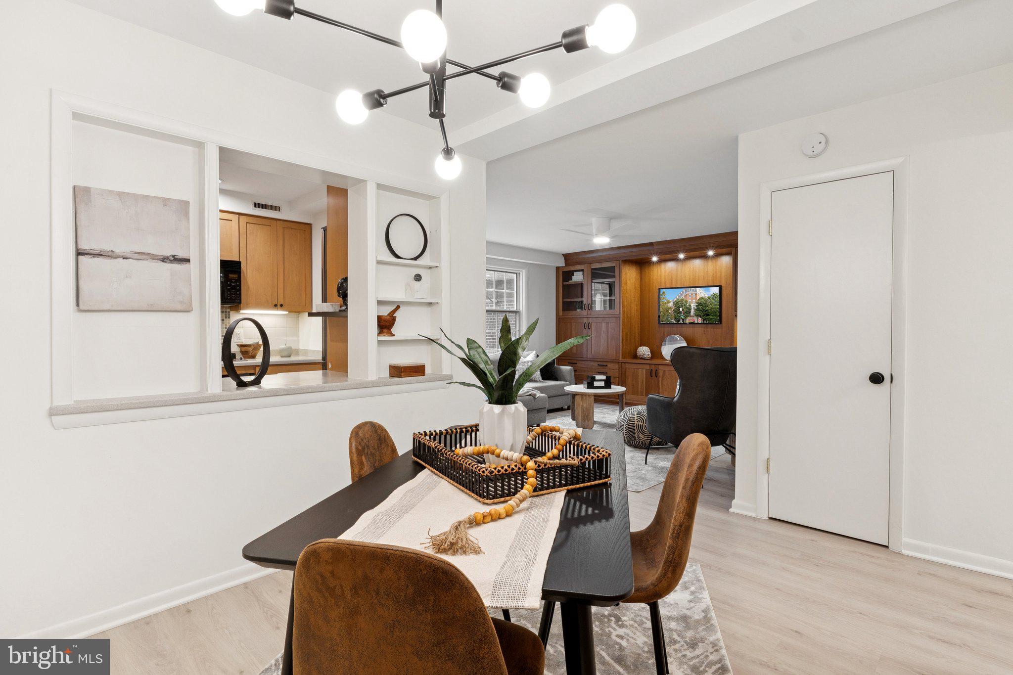 1880 Columbia Road Northwest, Unit 204 Washington, DC 20009 - Photo 7 of 23 a view of a dining room with furniture and a chandelier