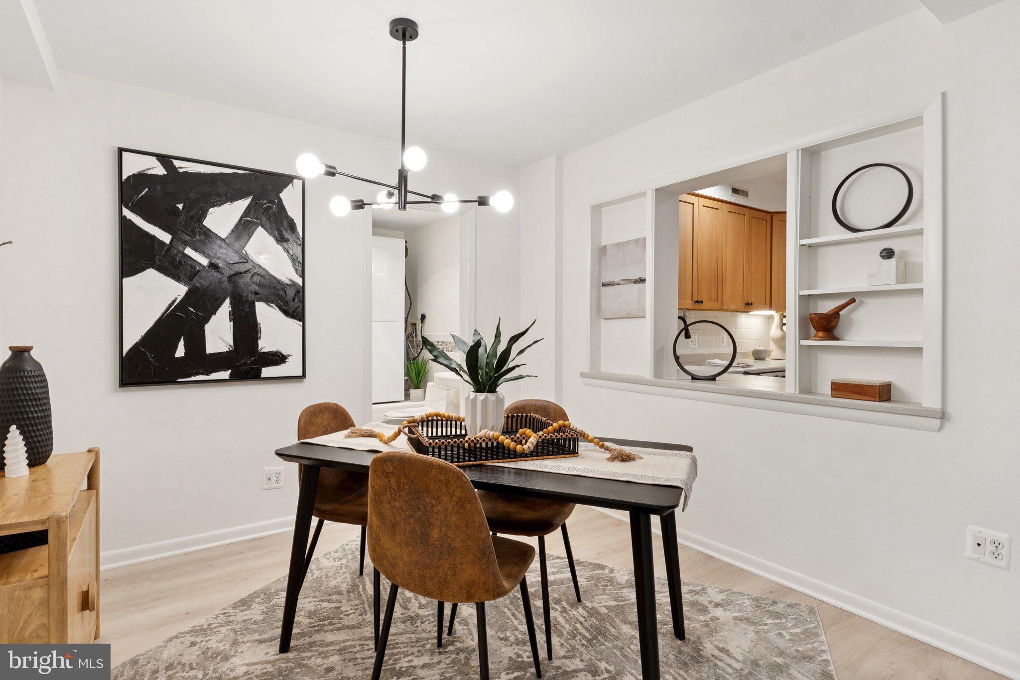 1880 Columbia Road Northwest, Unit 204 Washington, DC 20009 - Photo 8 of 23 a view of a dining room with furniture and chandelier