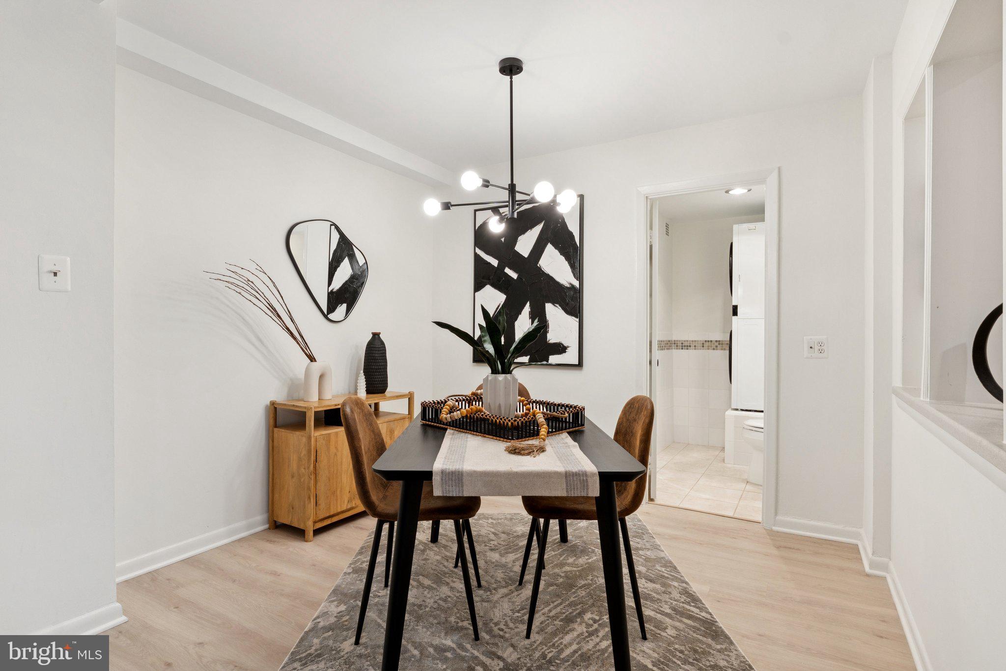 1880 Columbia Road Northwest, Unit 204 Washington, DC 20009 - Photo 9 of 23 a table and chairs in a room