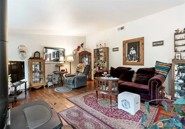 a bedroom with two beds and a window