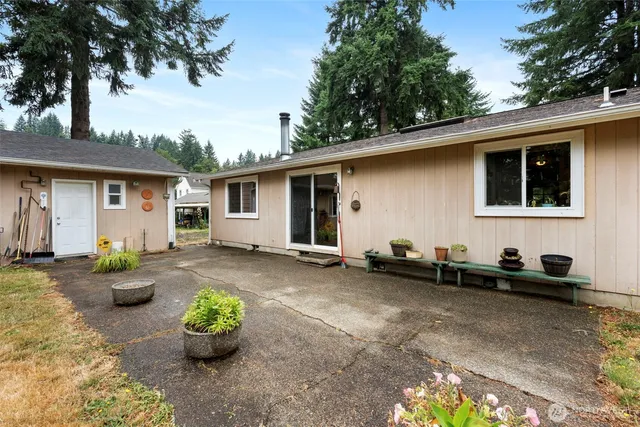 an aerial view of a city with lots of residential buildings and mountain view in back