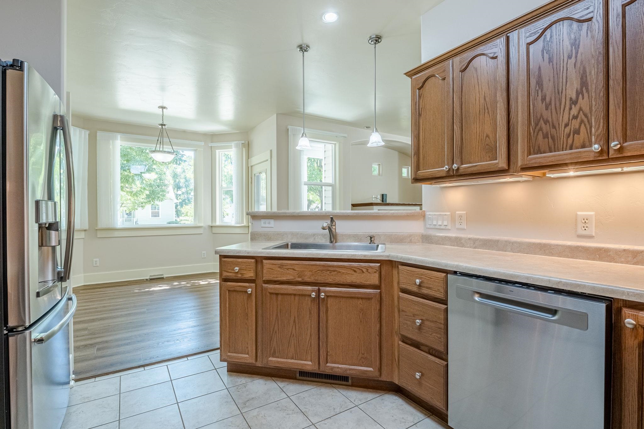 812 Alyssum Court Fruita, CO 81521 - Photo 14 of 41 a kitchen with a sink window and cabinets