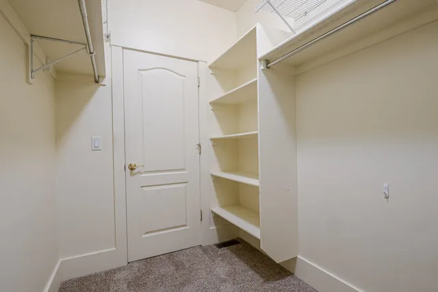 a view of an empty walk in closet