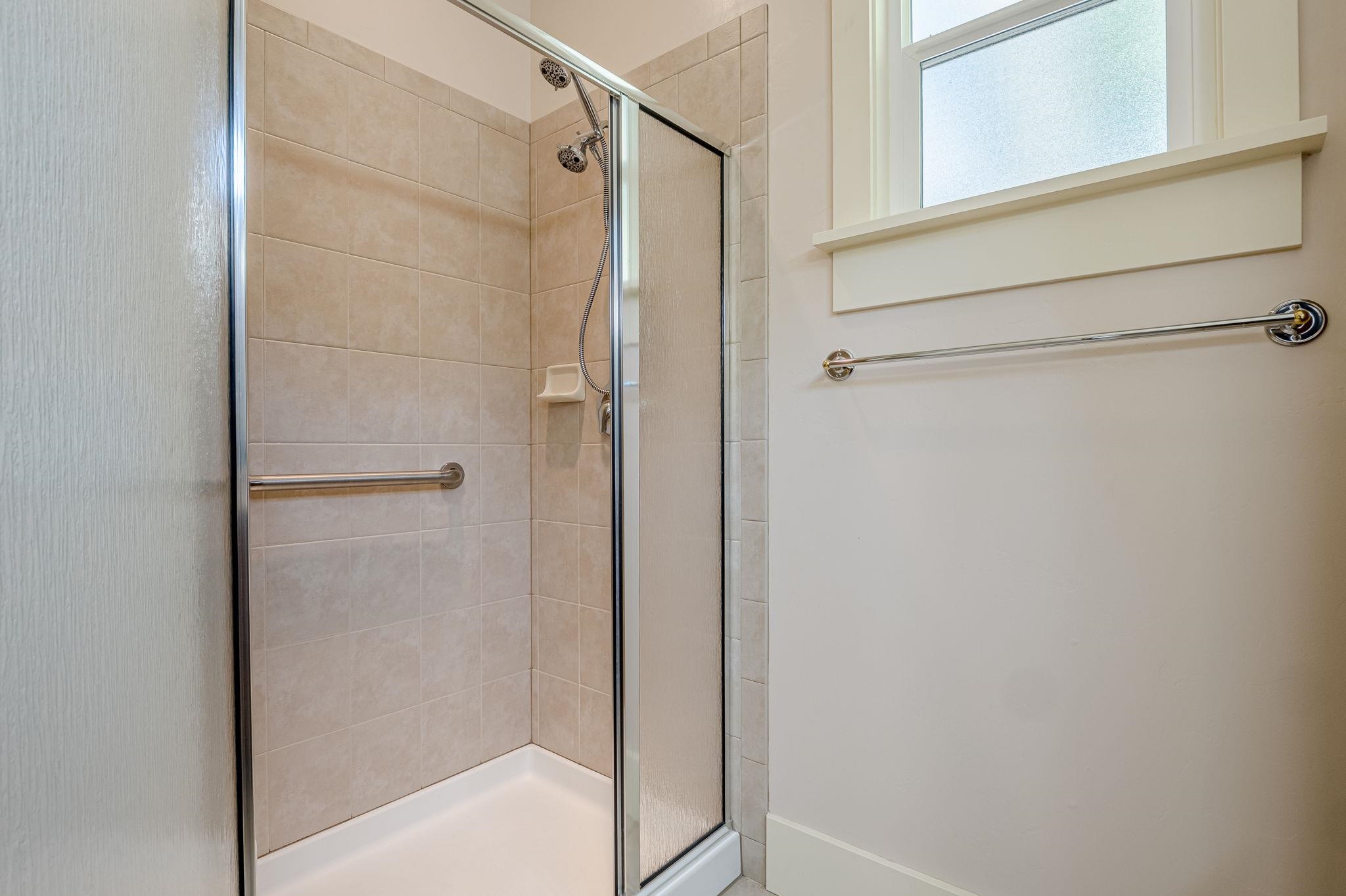 812 Alyssum Court Fruita, CO 81521 - Photo 23 of 41 a bathroom with a glass shower door