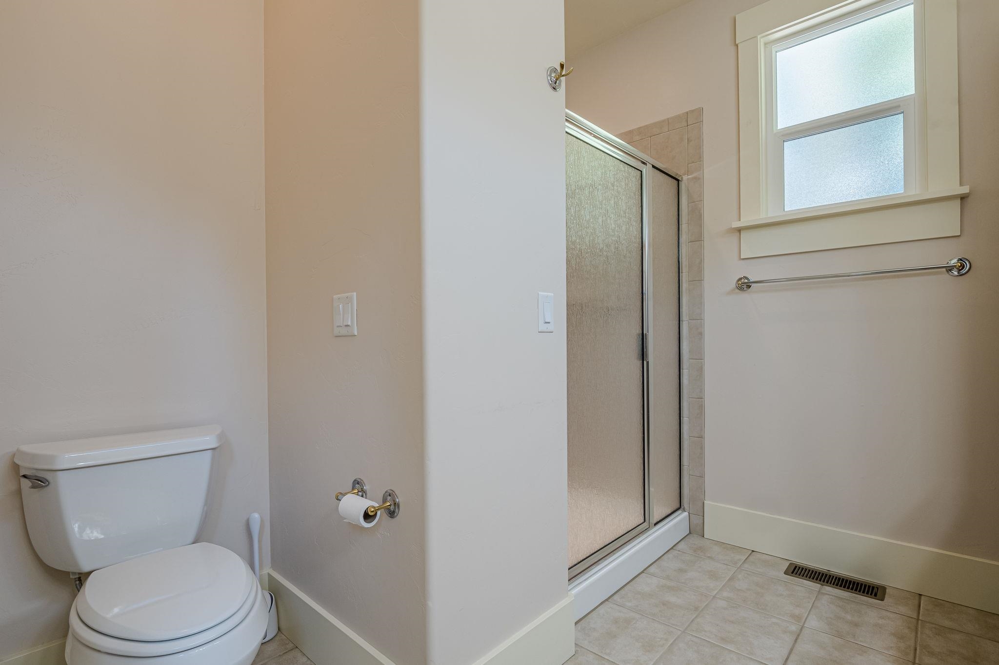 812 Alyssum Court Fruita, CO 81521 - Photo 25 of 41 a white toilet sitting next to a window