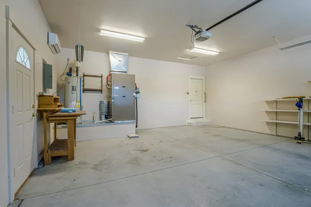 a view of kitchen with furniture and a refrigerator