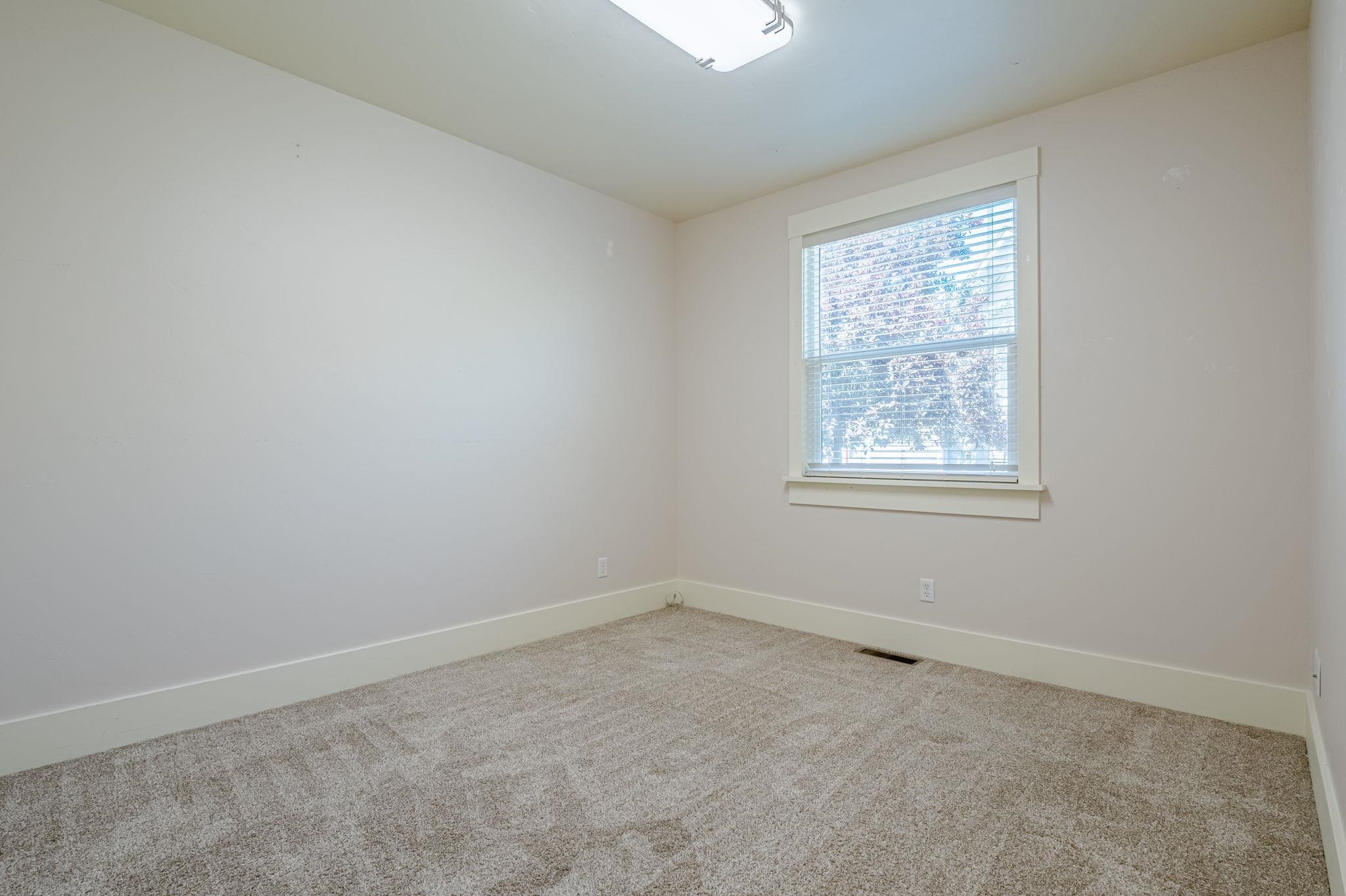 812 Alyssum Court Fruita, CO 81521 - Photo 32 of 41 an empty room with a window