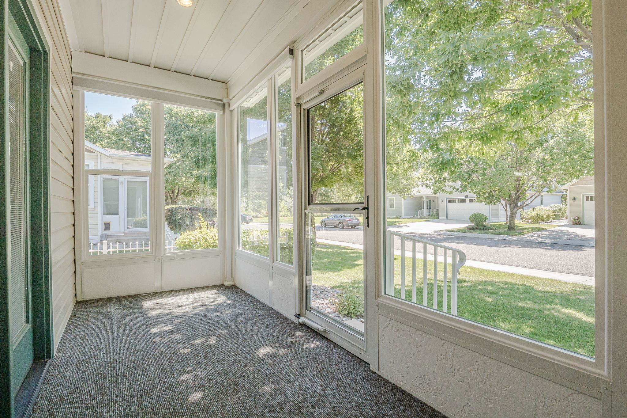812 Alyssum Court Fruita, CO 81521 - Photo 34 of 41 a view of an empty room with wooden floor and a yard