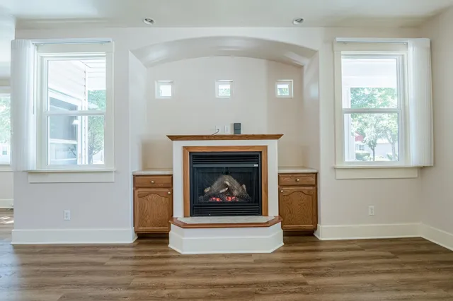 a living room with furniture and a fireplace