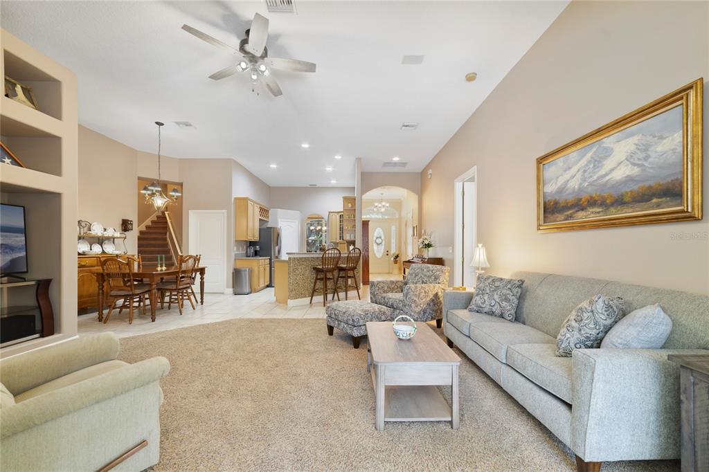 3374 Furlong Way Gotha, FL 34734 - Photo 11 of 38 a living room with furniture kitchen view and a chandelier