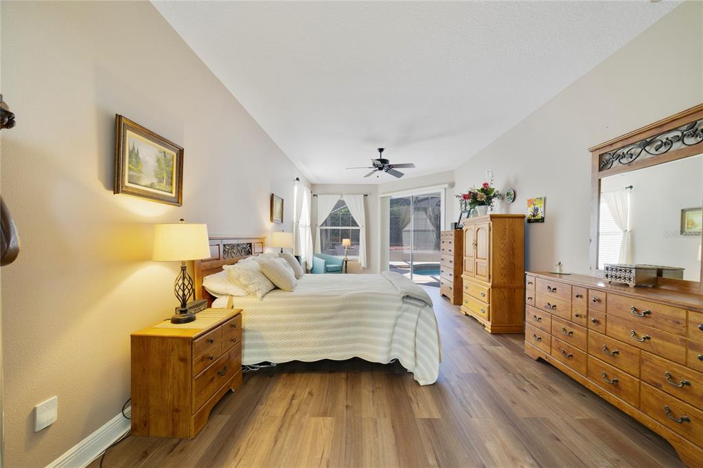 3374 Furlong Way Gotha, FL 34734 - Photo 14 of 38 a bedroom with bed and wooden floor