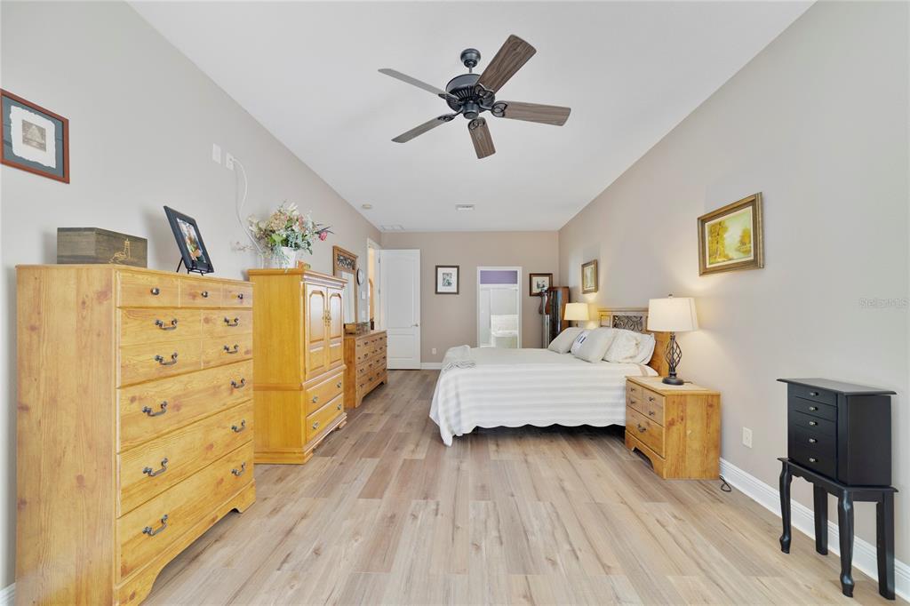 3374 Furlong Way Gotha, FL 34734 - Photo 16 of 38 a bedroom with a bed and furniture