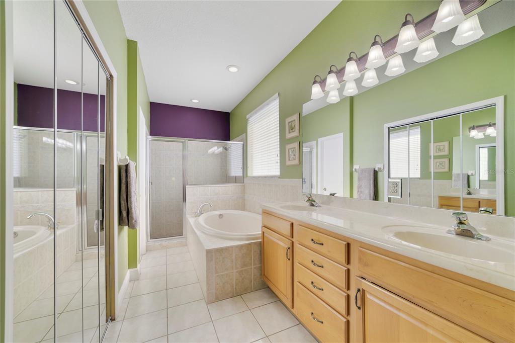 3374 Furlong Way Gotha, FL 34734 - Photo 17 of 38 a spacious bathroom with a double vanity sink mirror and bathtub