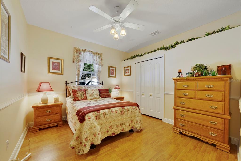 3374 Furlong Way Gotha, FL 34734 - Photo 21 of 38 a bedroom with a bed and a dresser