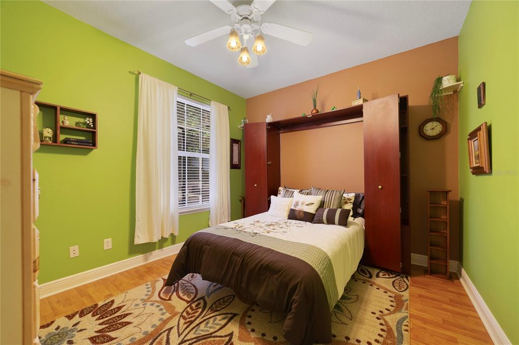 3374 Furlong Way Gotha, FL 34734 - Photo 22 of 38 a bedroom with a bed and a chandelier