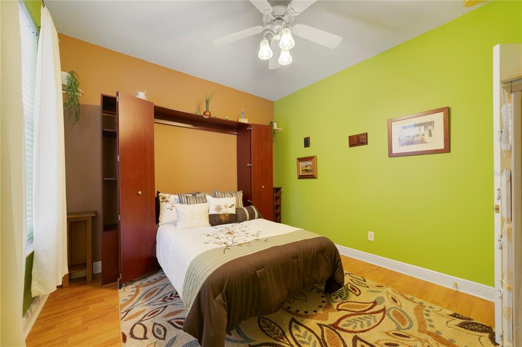 3374 Furlong Way Gotha, FL 34734 - Photo 23 of 38 a bedroom with a bed and a chandelier