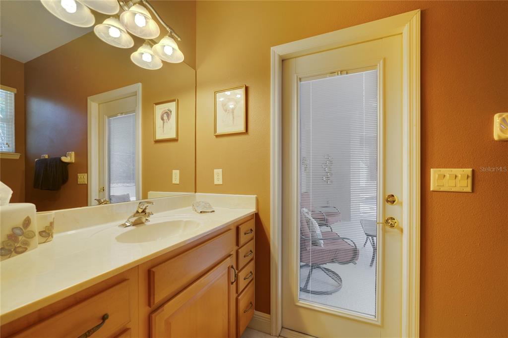3374 Furlong Way Gotha, FL 34734 - Photo 24 of 38 a bathroom with a sink a mirror and a shower