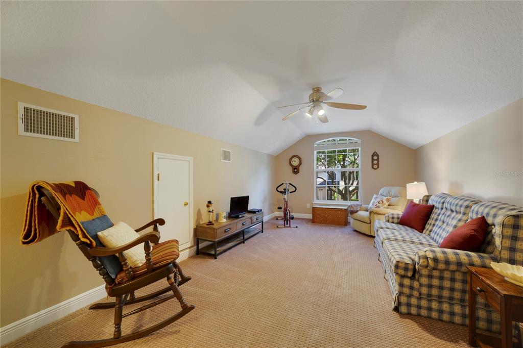 3374 Furlong Way Gotha, FL 34734 - Photo 26 of 38 a living room with furniture and a chandelier