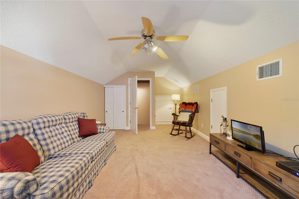 3374 Furlong Way Gotha, FL 34734 - Photo 27 of 38 a bedroom with a bed and a tv